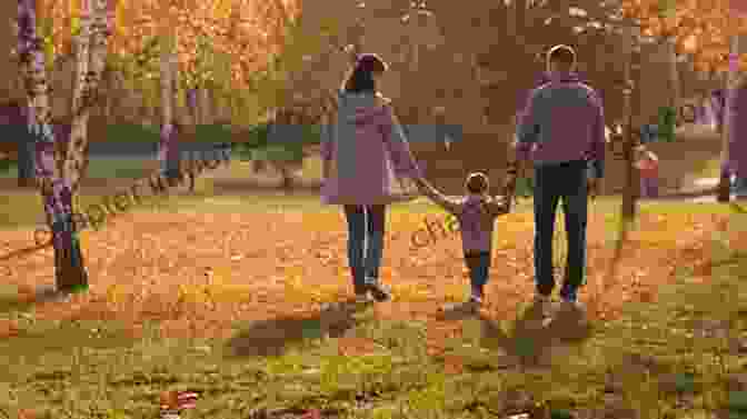 A Happy Family Of Three Takes A Walk In The Park. Soon To Be DAD: Handbook For Expectant Fathers