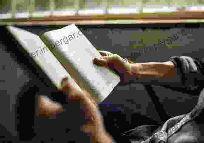 A Pair Of Hands Holding An Open Copy Of The Akuti Book Akuti Nancy Blakey